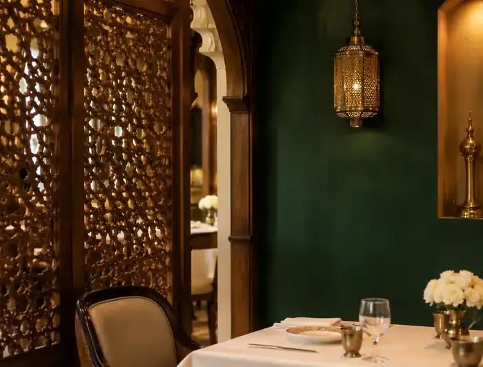 A quiet corner table beside a carved screen at Appayon